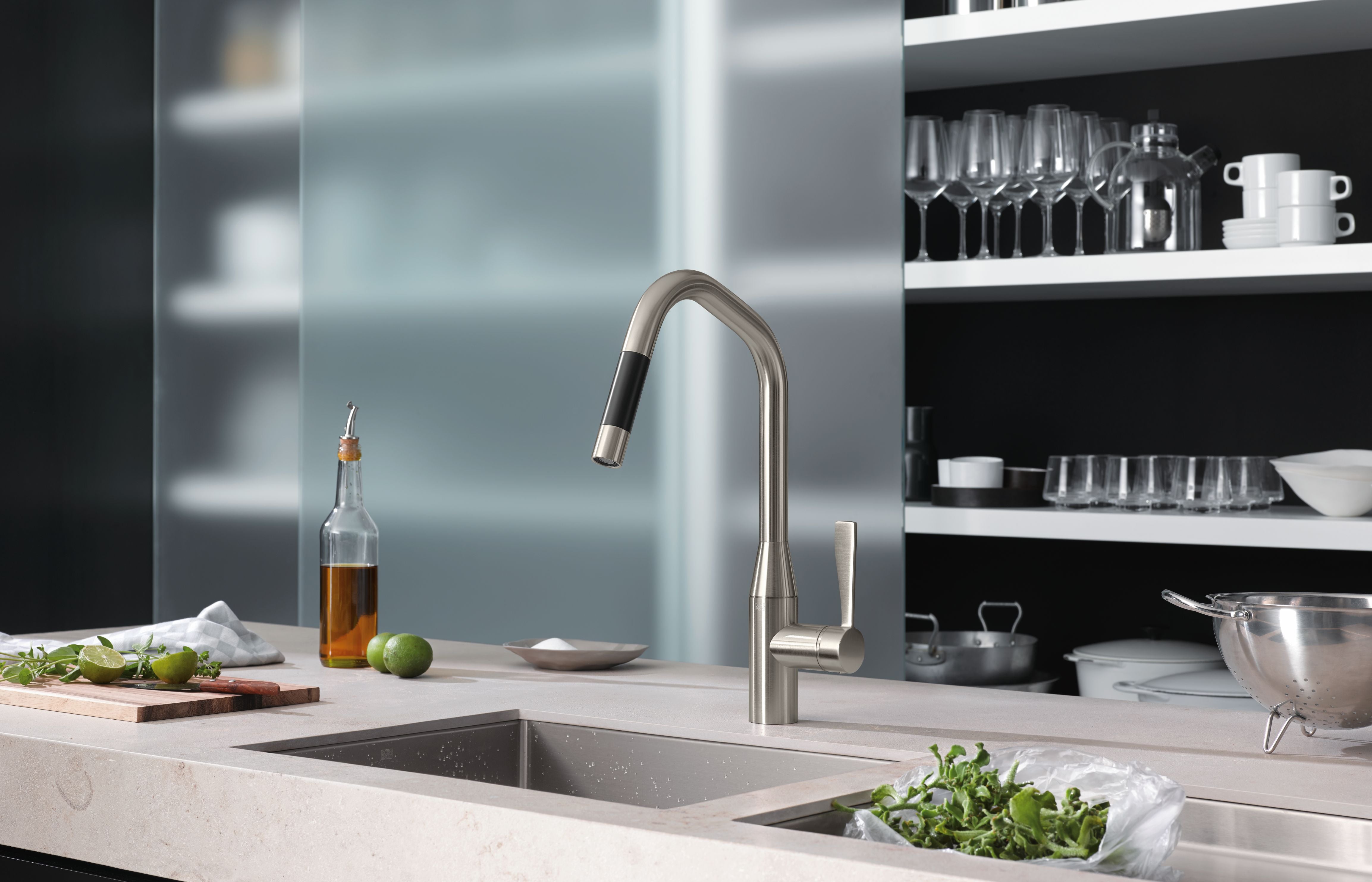 Modern kitchen with a sink and faucet, shelves with kitchenware in the background