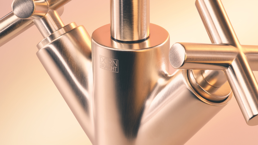 Close-up of a modern kitchen faucet with 'Dornbracht' branding on a peach background.