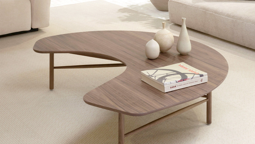 Wooden coffee table with decorative items in a living room setting