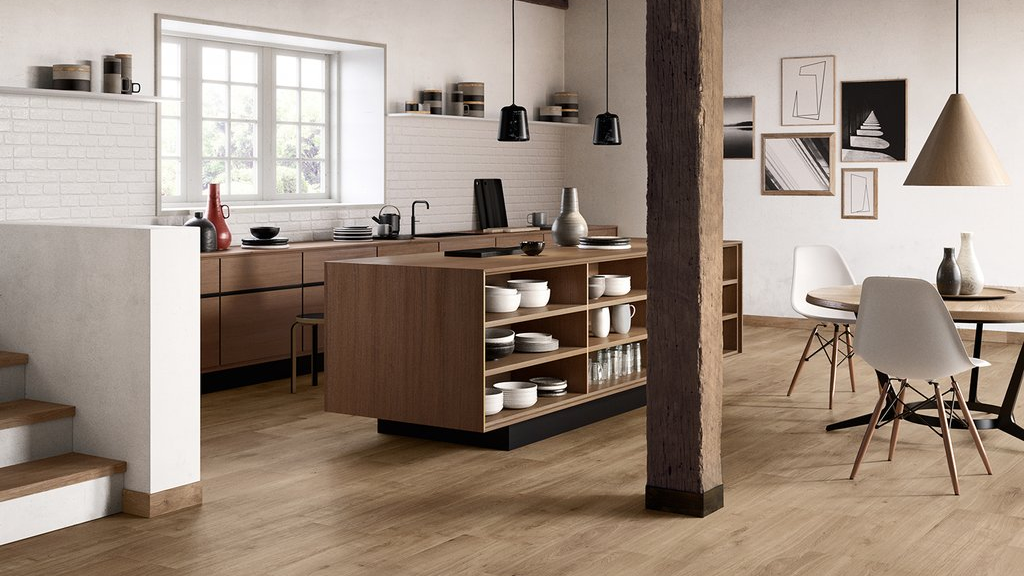 Modern kitchen with wooden island and white walls
