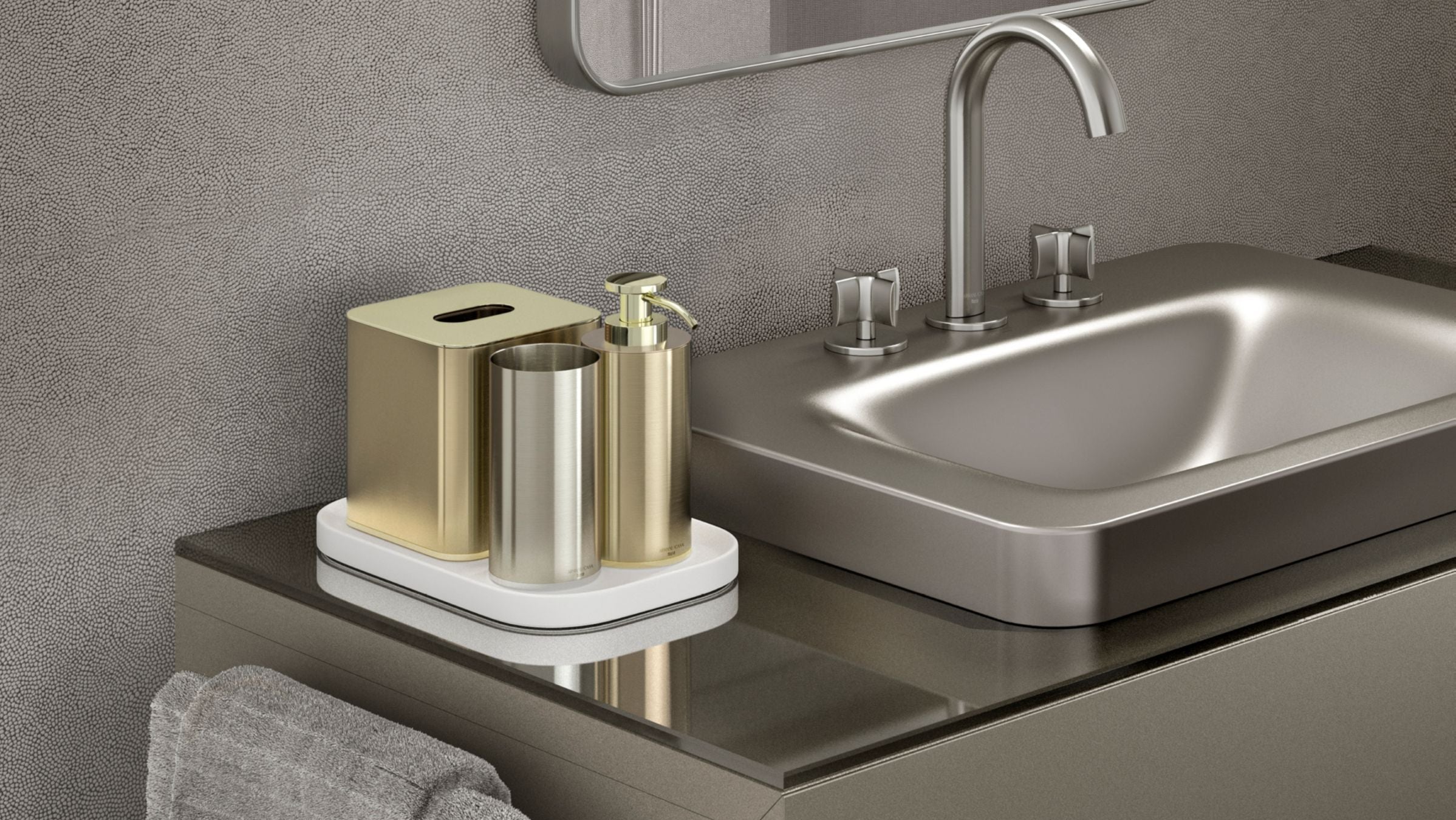 Bathroom setup with sink, mirror, and bathroom accessories on a gray wall.