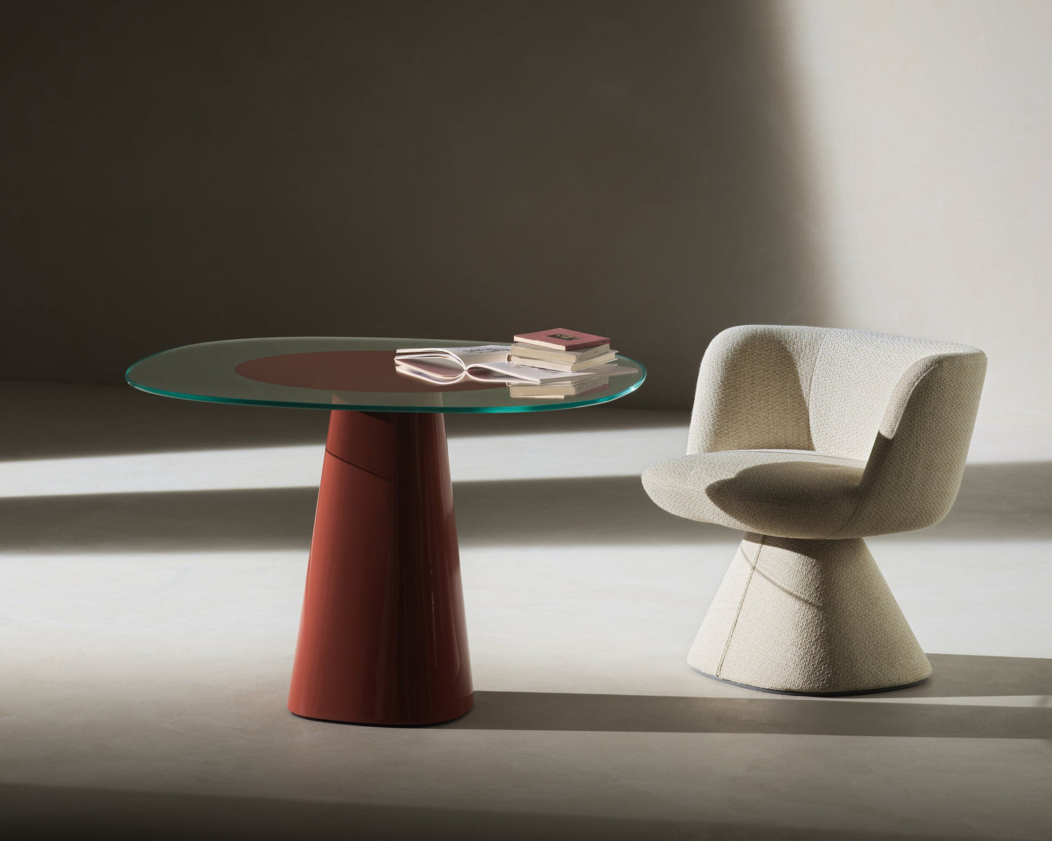 Modern chair and round table in a minimalistic setting with soft lighting