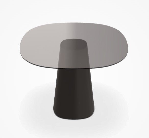 Round glass table with a black pedestal base on a white background